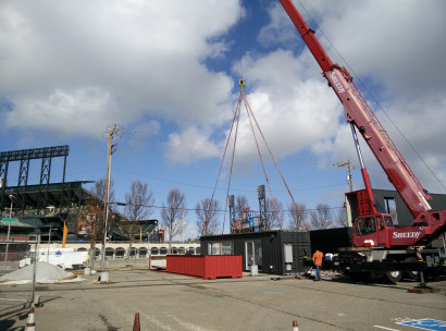 Container 5 is about to be lifted into position. 